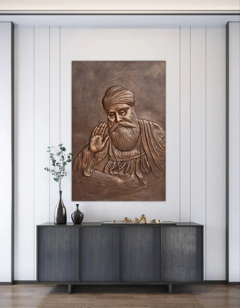 Best Sikh Wall Art 3D Relief Mural featuring a serene 3D portrait of Guru Nanak Dev Ji in antique bronze finish, handcrafted wall décor by Artgatha.