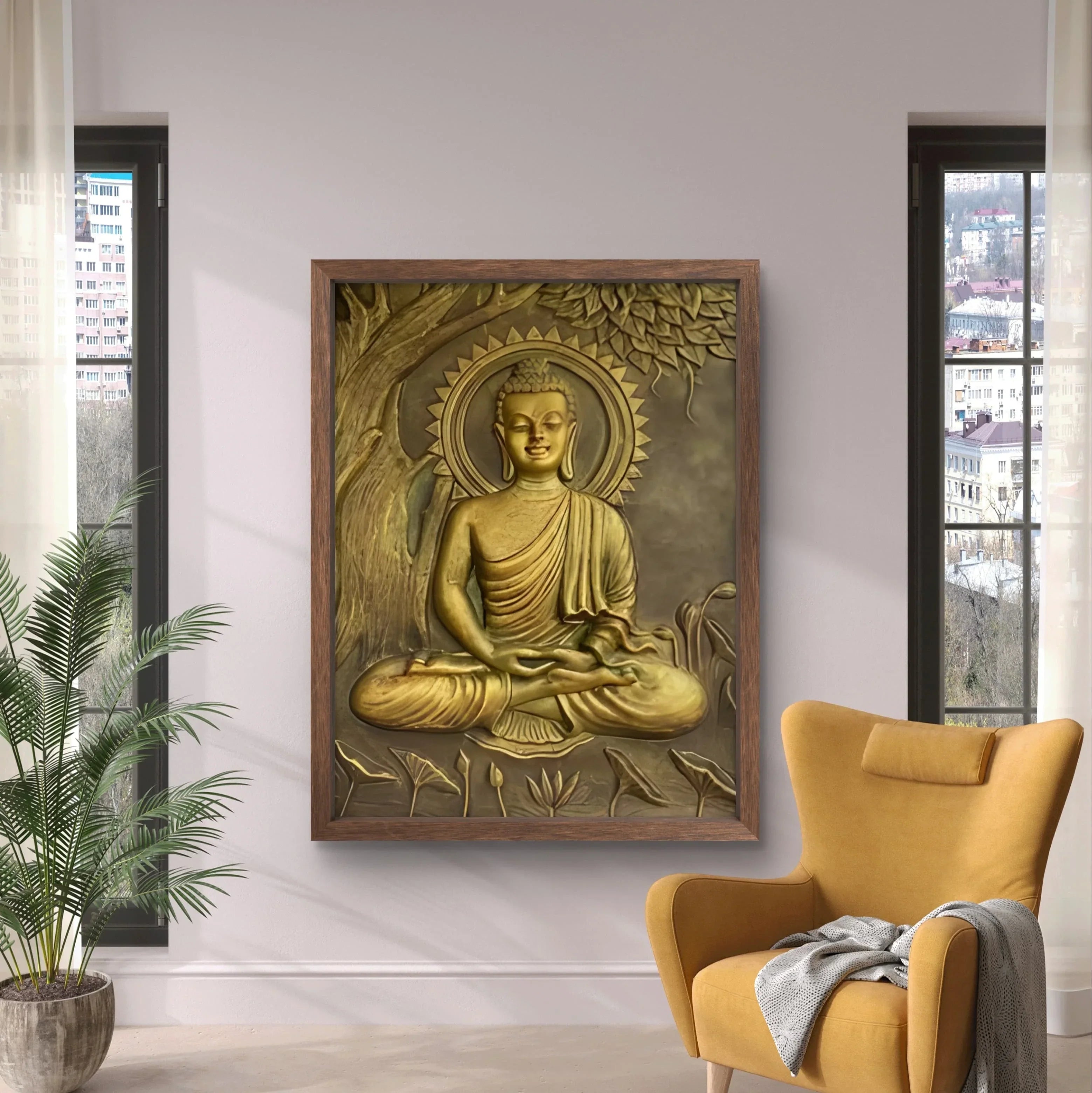 A golden Buddha wall mural design framed in wood, displayed in a modern living room with natural light, indoor plants, and a cozy mustard chair.