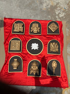 Detailed texture of Ashtamangala wall art sculptures showing layered relief craftsmanship