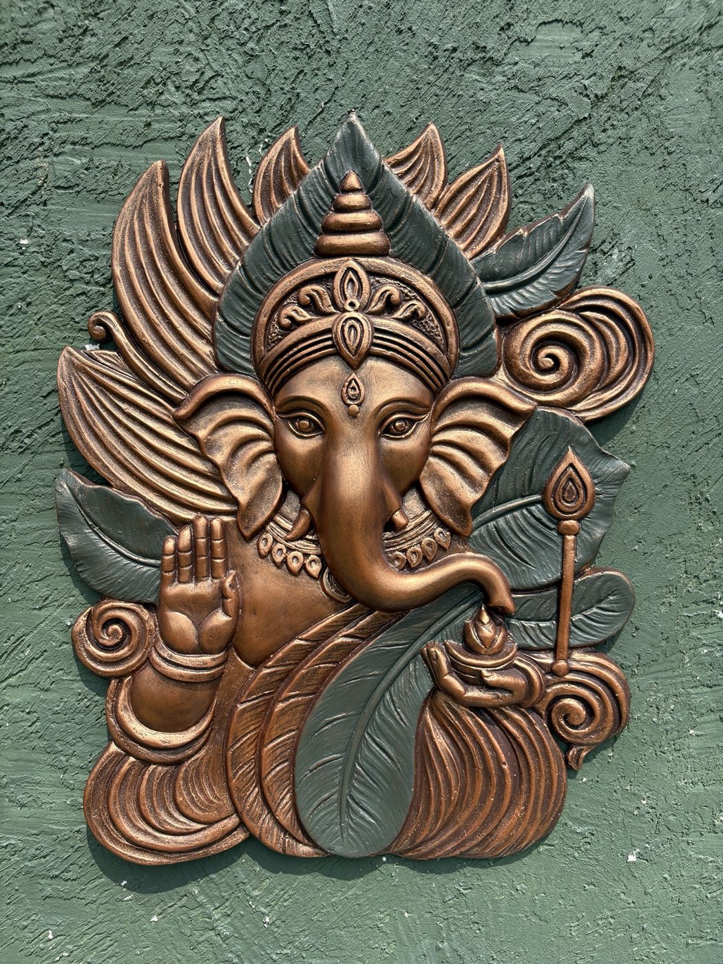 Detailed texture of Elegant Ganesha wall mural showing layered relief craftsmanship.