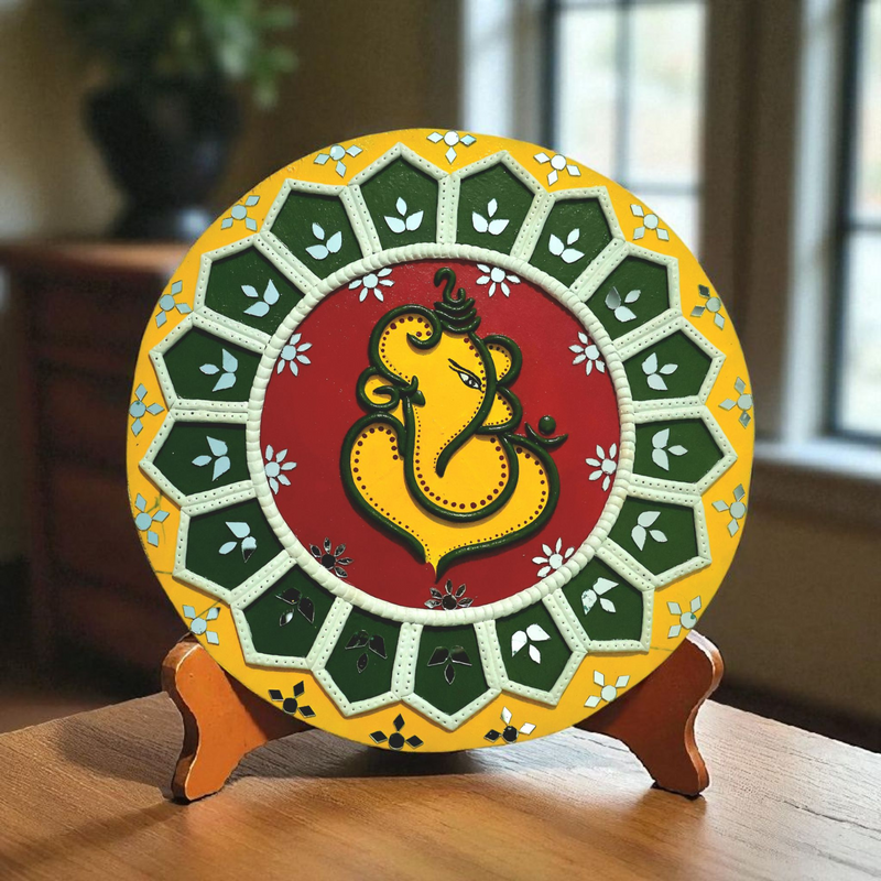Handmade Lippan art of Lord Ganesha in a 12x12 inch frame, symbolizing wisdom, blessings, and traditional Indian craftsmanship.