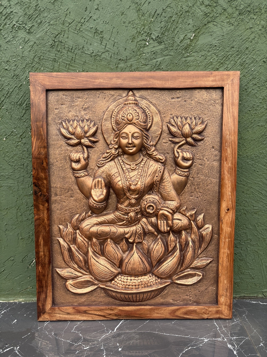 Close-up of Goddess Lakshmi 3D relief wall art highlighting intricate sculpted details and craftsmanship.