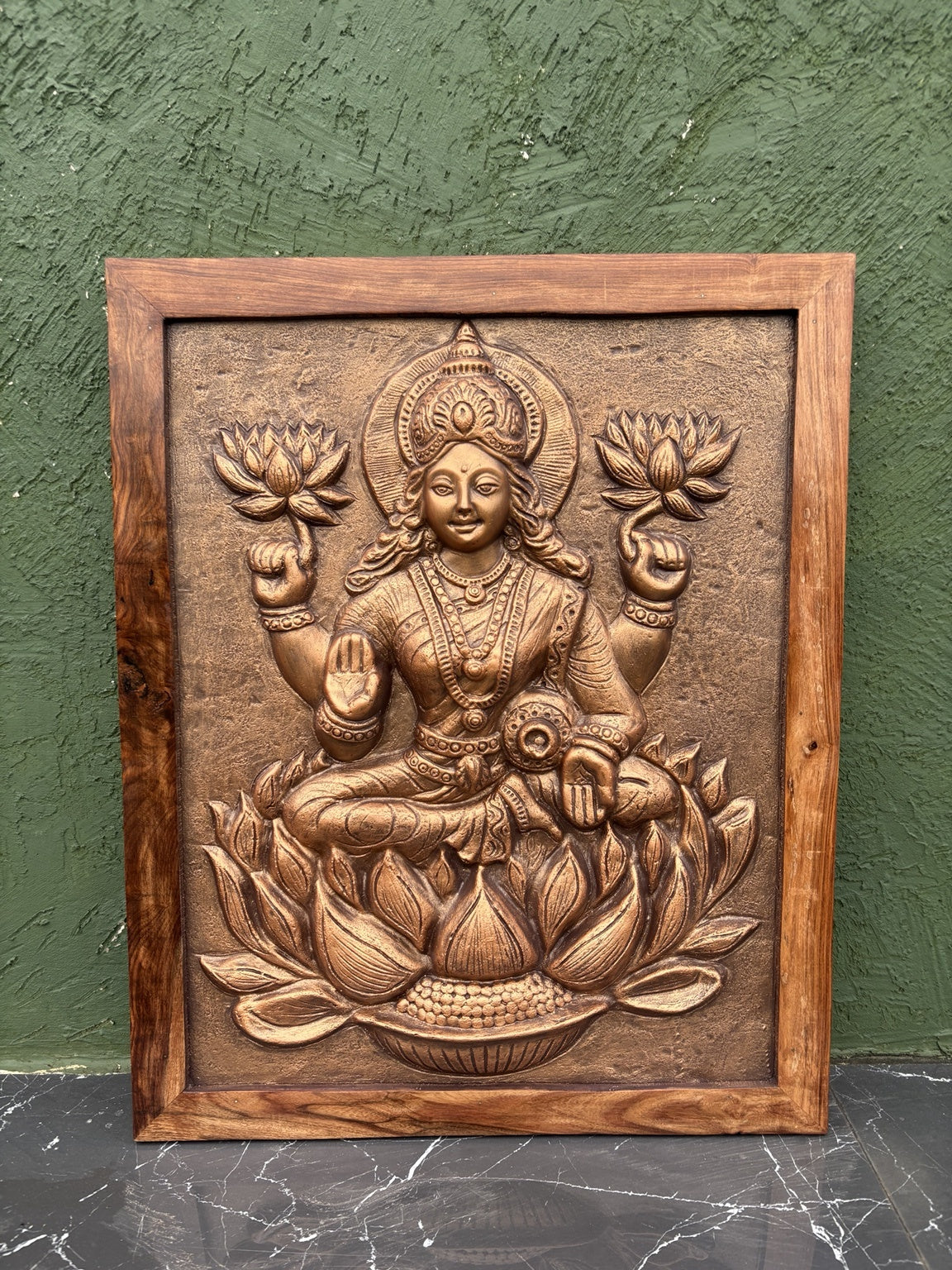 Close-up of Goddess Lakshmi 3D relief wall art highlighting intricate sculpted details and craftsmanship.