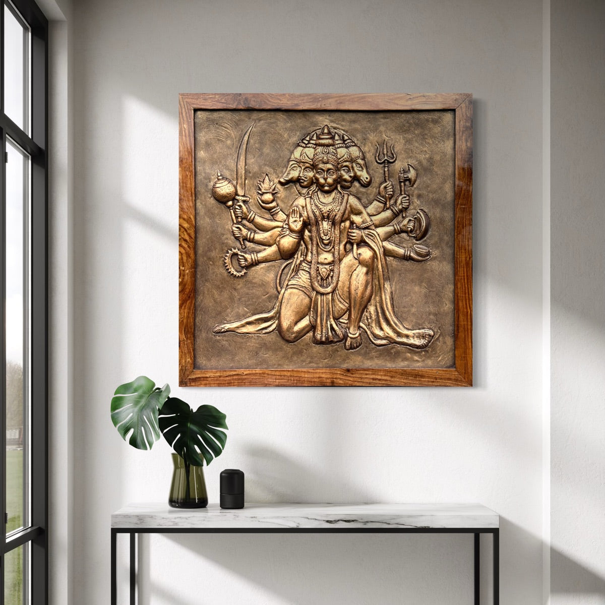 Close-up of Panchmukhi Hanuman 3D relief wall art in bronze colour  highlighting intricate sculpted details.