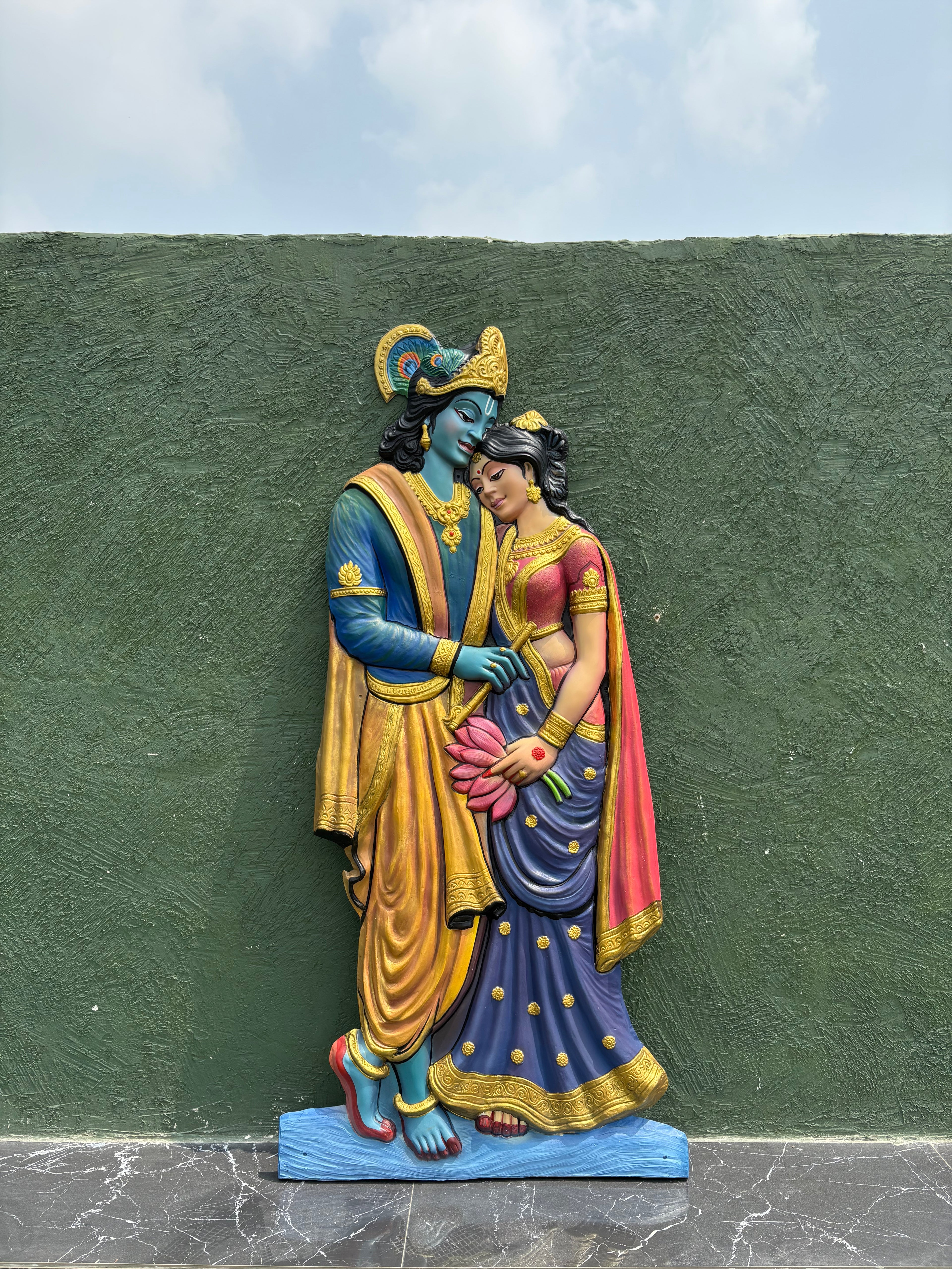 Radha Krishna body cutout 3D wall art displaying depth through natural light and shadow effects.