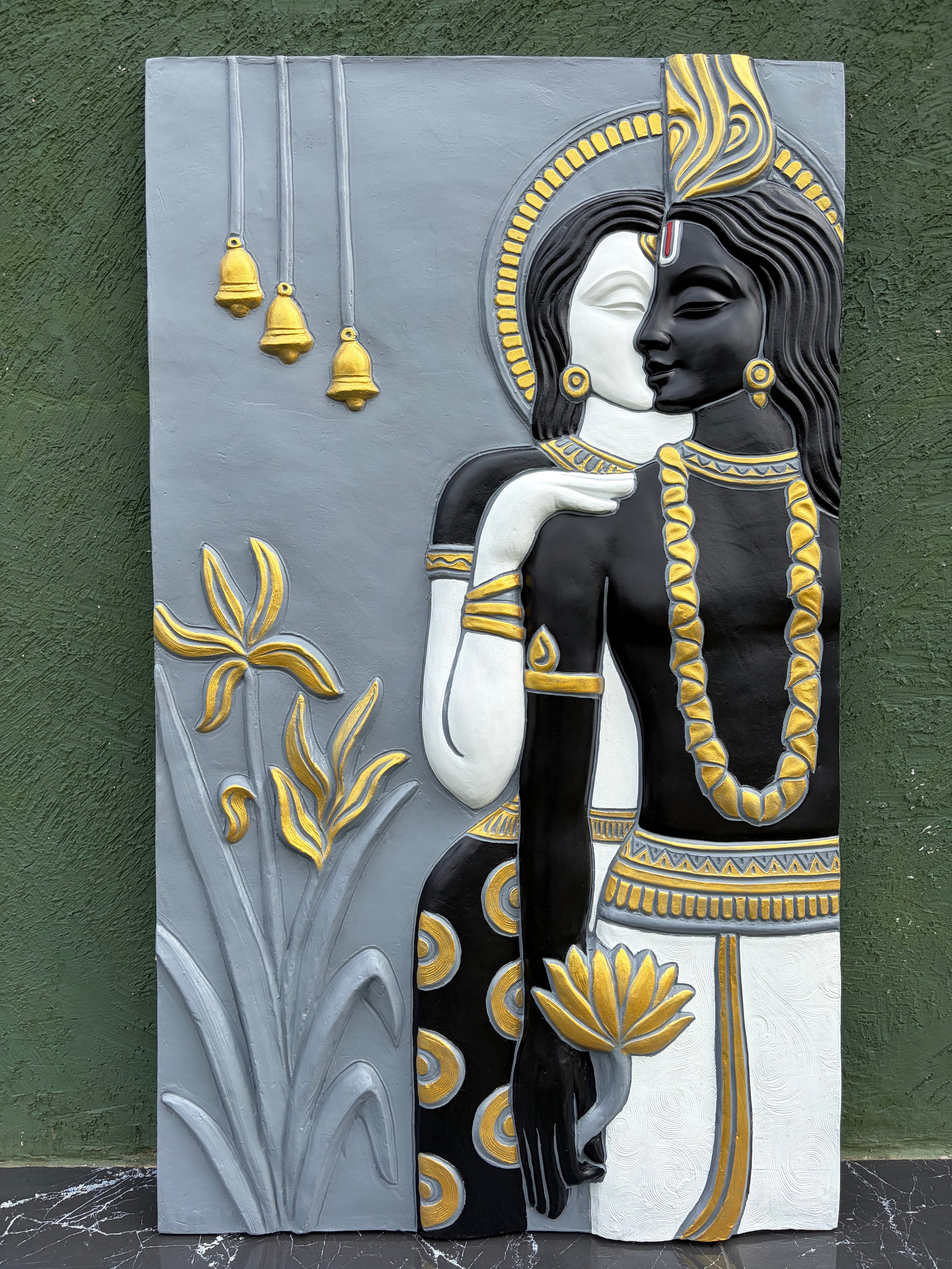 Large handcrafted Radha Krishna 3D relief wall art used as a spiritual feature wall centerpiece.