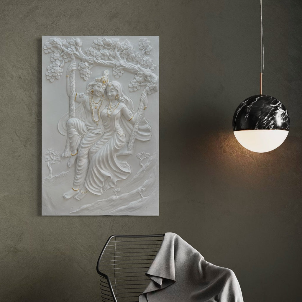 Detailed texture of Radha Krishna swing wall sculpture showing layered relief craftsmanship.