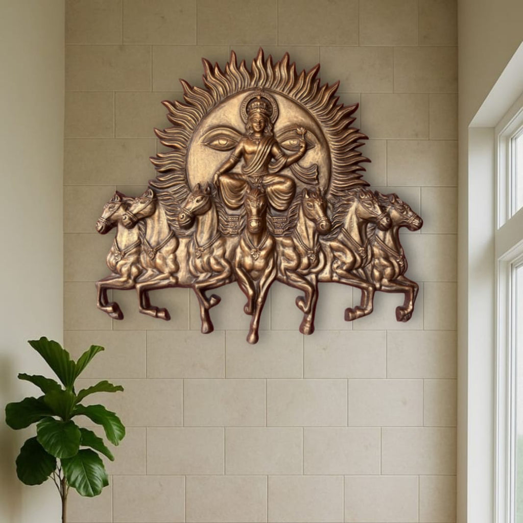 Handcrafted Surya Narayana wall art depicting the divine Sun God riding a chariot drawn by seven horses in bronze color and size is 4x3.5 feet