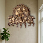 Handcrafted Surya Narayana wall art depicting the divine Sun God riding a chariot drawn by seven horses in bronze color and size is 4x3.5 feet