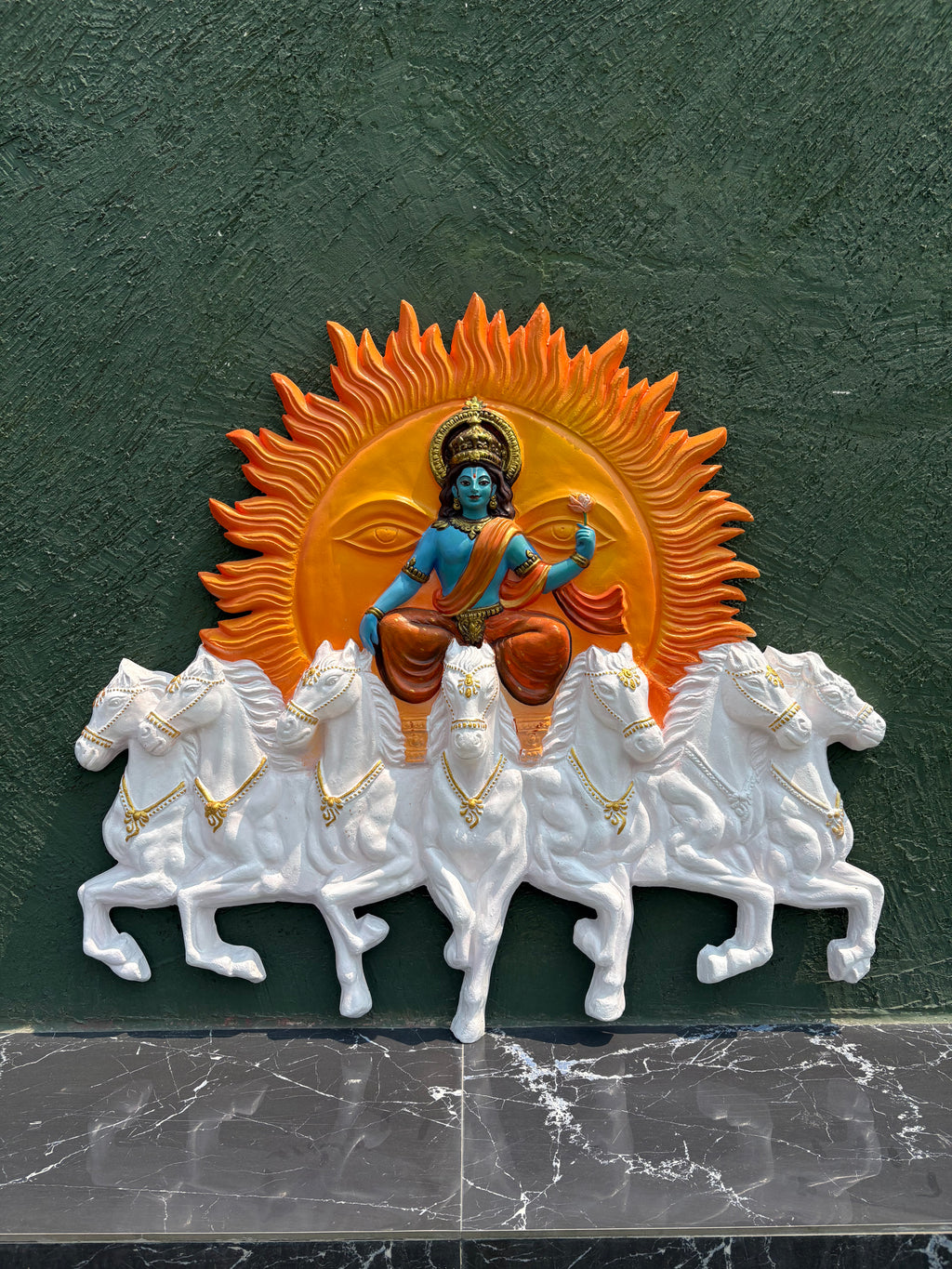 Handcrafted Surya Narayana wall art depicting the divine Sun God riding a chariot drawn by seven horses in multicolour and size is 4x3.5 feet