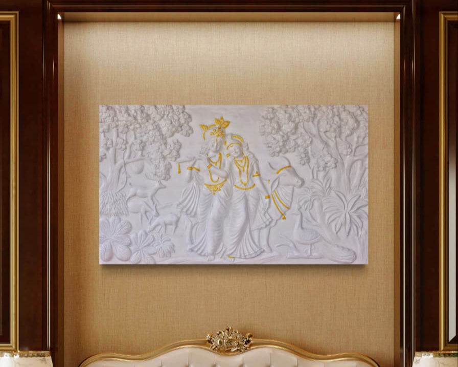 Close-up of the white unframed Radha Krishna mural, showcasing intricate sculpted detailing with Golden highlights.